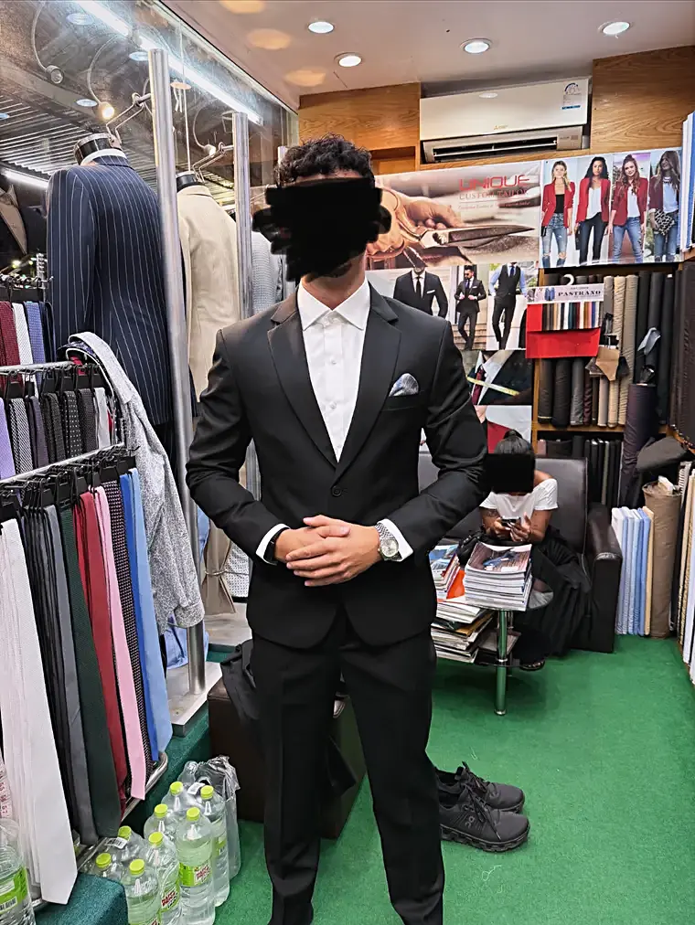 Client in a black bespoke suit