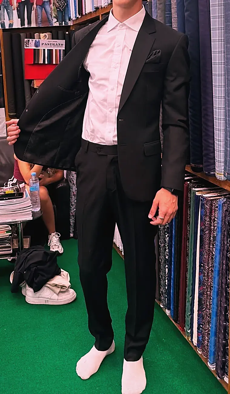 Client in a black made-to-measure suit