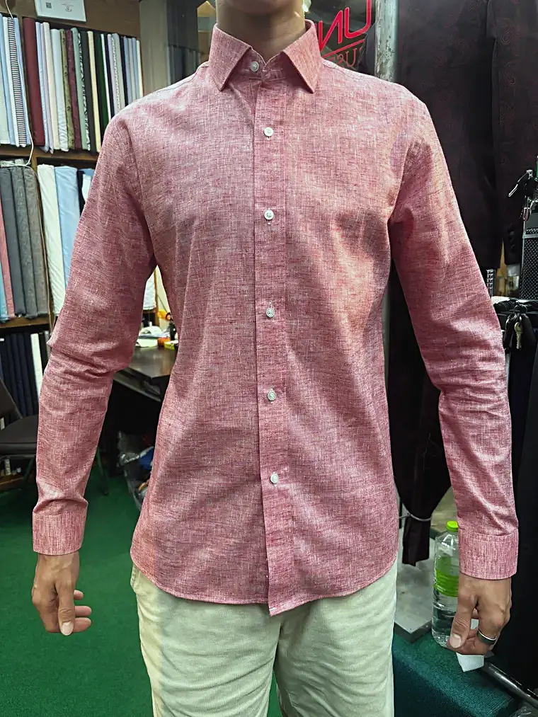 Client in a custom pink linen shirt