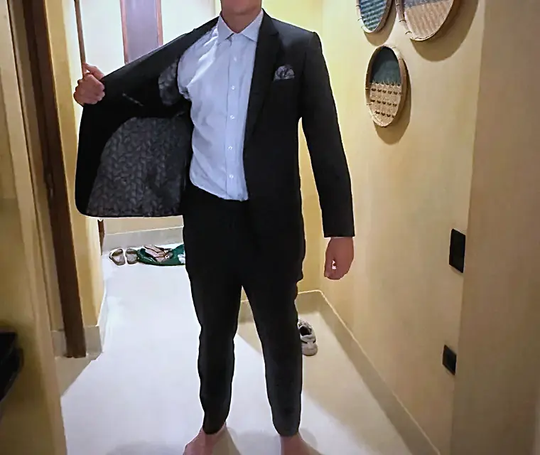 Client in a black bespoke suit