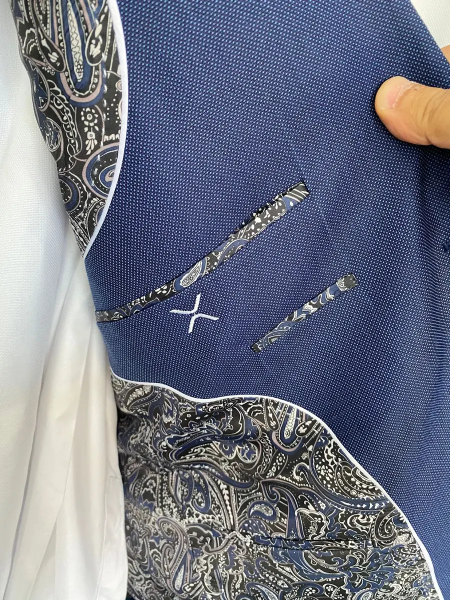Navy jacket with hand-finished monogram detail