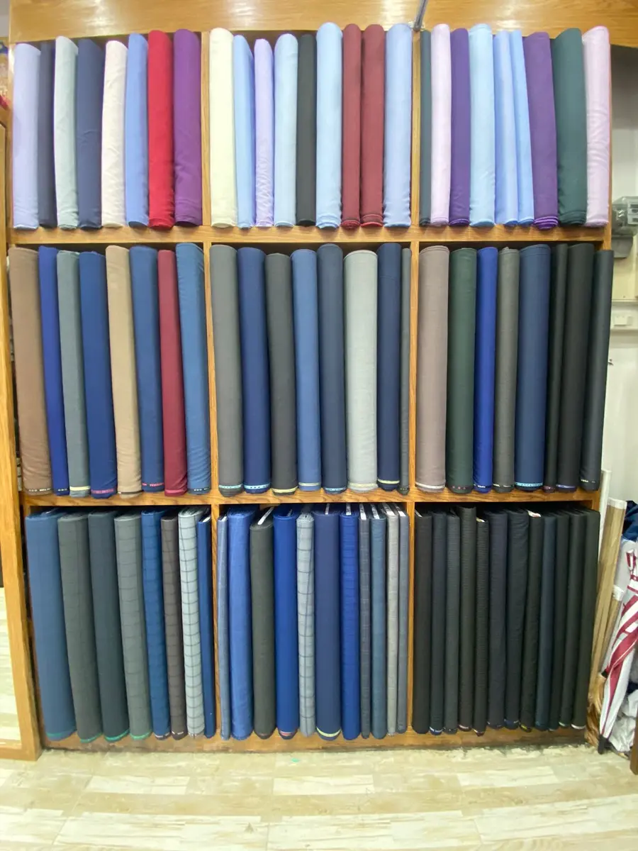 The fabric selection on the atelier shelves