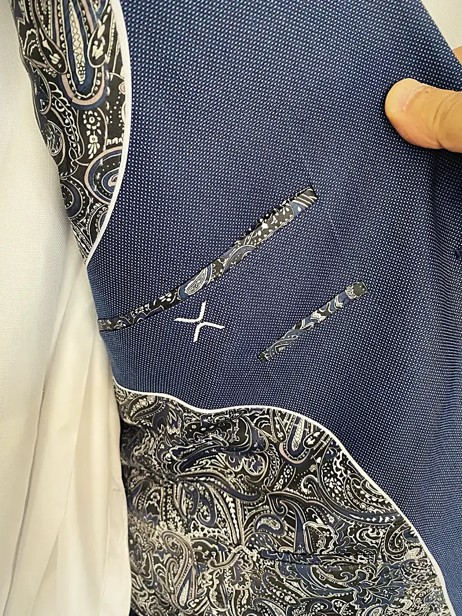 Navy jacket with hand-finished monogram detail