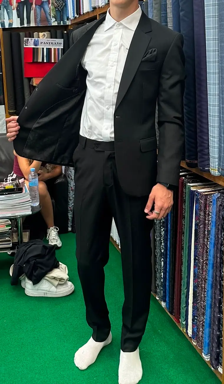 Client in a black made-to-measure suit