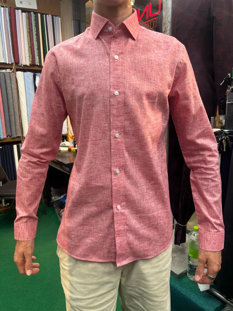 Client in a custom pink linen shirt