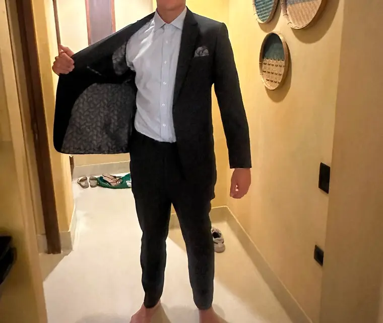 Client in a black bespoke suit